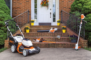 What factors should one consider when selecting a lawnmower engine for specific lawn sizes or terrains?