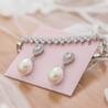 The Perfect Blend of Charm and Sophistication: Ivy &amp; Pearl Pearl Huggie Earrings 